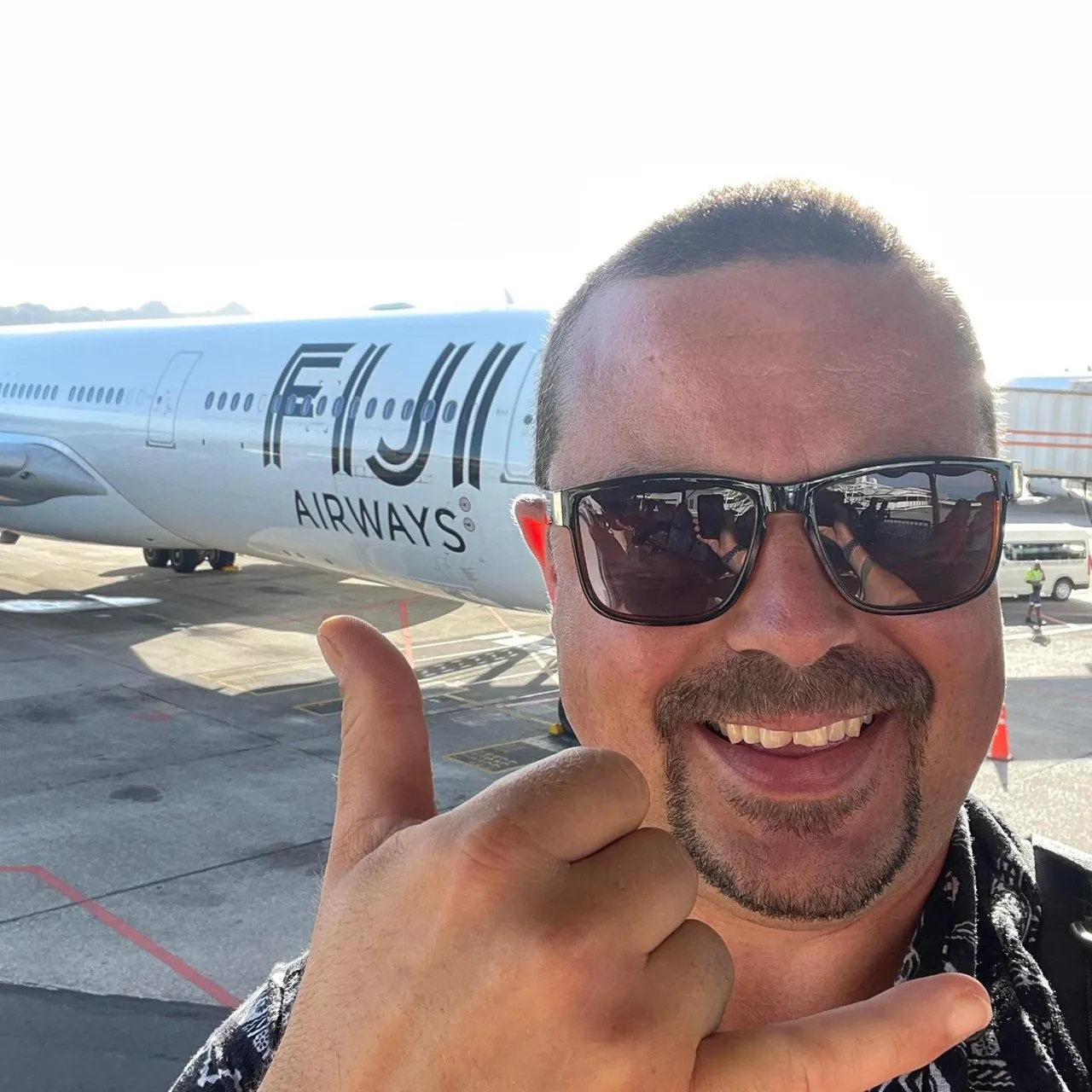 Tom Holder, founder of TC Holding, in front of a Fiji Airways aircraft